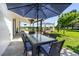 Inviting patio with dining table, chairs, and views of the landscaped backyard at 9232 N Surrey Dr, Castle Rock, CO 80108