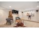 Finished basement featuring a sitting area with a mini bar and unique decor at 7624 Russell Ct, Arvada, CO 80007