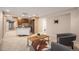 Finished basement with a kitchenette, cozy seating area, and a unique accent rug at 7624 Russell Ct, Arvada, CO 80007