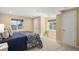 Bedroom with two windows and neutral carpet at 7624 Russell Ct, Arvada, CO 80007