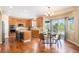 Spacious kitchen with granite countertops, stainless steel appliances, and a dining area at 7624 Russell Ct, Arvada, CO 80007