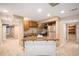 Basement kitchenette featuring stainless steel appliances and a central island at 7624 Russell Ct, Arvada, CO 80007