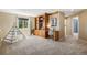 Cozy loft area with built-in shelving, a desk, and a teepee for a relaxed and fun atmosphere at 7624 Russell Ct, Arvada, CO 80007
