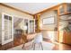 Office with hardwood floors, french doors, built-in shelving, and natural light at 7624 Russell Ct, Arvada, CO 80007