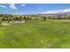 Expansive green open space featuring a playground and mountain views, perfect for outdoor activities at 7624 Russell Ct, Arvada, CO 80007