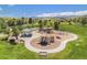 Community playground offers slides, climbing structures, and shaded picnic area with mountain views at 7624 Russell Ct, Arvada, CO 80007