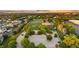 Beautiful aerial view of a baseball field, parking lot, and neighborhood homes at sunset at 3090 W 107 Pl # F, Westminster, CO 80031