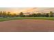 Baseball field view showcasing the pitcher's mound and well-maintained dirt infield at 3090 W 107 Pl # F, Westminster, CO 80031