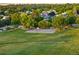 View of a community basketball court surrounded by grass and trees, ideal for recreation at 3090 W 107 Pl # F, Westminster, CO 80031