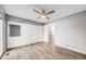 Spacious bedroom features a ceiling fan, wood floor, and sliding glass door at 3090 W 107 Pl # F, Westminster, CO 80031