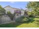 Back exterior of home with deck and some landscaping at 3090 W 107 Pl # F, Westminster, CO 80031