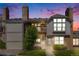 Charming two-story home featuring a brick facade, a small balcony, and a well-manicured lawn at 3090 W 107 Pl # F, Westminster, CO 80031