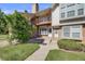 The front exterior of the home is landscaped, with stairs up to the entrance at 3090 W 107 Pl # F, Westminster, CO 80031