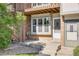 Charming front entrance with brick facade, and stairs to entrance at 3090 W 107 Pl # F, Westminster, CO 80031