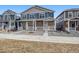 Attractive two-story home highlighting a stone facade, a welcoming porch, and a well-kept front yard at 22384 E 6Th Pl, Aurora, CO 80018