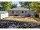 Backyard with a shed, mulch landscaping, and a play structure, perfect for Gathering fun at 4921 Beach Ct, Denver, CO 80221