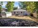 Spacious backyard featuring a shed, and mulch landscaping, ideal for outdoor activities and relaxation at 4921 Beach Ct, Denver, CO 80221