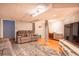Finished basement featuring a comfortable seating area, warm wood floors, and neutral décor at 4921 Beach Ct, Denver, CO 80221