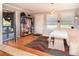 Sunny breakfast nook boasting a built-in bench, ample natural light, and hardwood flooring at 4921 Beach Ct, Denver, CO 80221