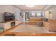 Spacious living room featuring hardwood floors, a comfortable sectional, and an open layout at 4921 Beach Ct, Denver, CO 80221