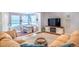 Cozy living room with a dining nook featuring a built-in bench and an entertainment center with an electric fireplace at 4921 Beach Ct, Denver, CO 80221