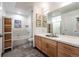 Stylish bathroom with a large vanity, a soaking tub, and a separate walk-in shower at 1438 Little Raven St # 301, Denver, CO 80202