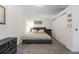 Cozy bedroom featuring a neutral color palette and lots of natural light from the windows at 1438 Little Raven St # 301, Denver, CO 80202
