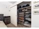 Walk-in closet with built-in shelving and ample storage for clothes and accessories at 1438 Little Raven St # 301, Denver, CO 80202
