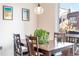 Cozy dining room features a wooden table with four chairs, artwork, and a hanging light fixture at 1438 Little Raven St # 301, Denver, CO 80202