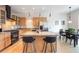 Open concept kitchen with stainless steel appliances and a granite island, connected to the dining area at 1438 Little Raven St # 301, Denver, CO 80202