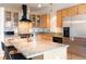 Bright kitchen featuring stainless steel appliances, granite counters, and wooden cabinets with glass fronts at 1438 Little Raven St # 301, Denver, CO 80202