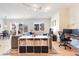 Bright living room featuring a large sectional couch, wood floors, and home office setup at 1438 Little Raven St # 301, Denver, CO 80202
