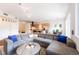 Spacious living room with hardwood floors, a large comfortable couch, and open floor plan at 1438 Little Raven St # 301, Denver, CO 80202