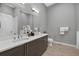 Modern bathroom featuring a double sink vanity with sleek fixtures and ample counter space at 2815 W 52Nd Ave, Denver, CO 80221