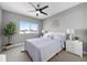 Well-lit bedroom with a ceiling fan, comfortable bed, and tasteful decor, enhancing relaxation at 2815 W 52Nd Ave, Denver, CO 80221