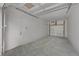 Spacious, well-lit garage features smooth concrete flooring, white walls, and an insulated garage door at 2815 W 52Nd Ave, Denver, CO 80221