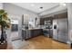 Well-equipped kitchen with stainless steel appliances, modern cabinetry, and access to outdoor area, perfect for cooking at 2815 W 52Nd Ave, Denver, CO 80221