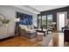 Comfortable living room with large windows, plush seating, and stylish accents, perfect for relaxing and entertaining at 2815 W 52Nd Ave, Denver, CO 80221