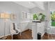 Charming wet bar area with ample cabinet space and a bright window at 2062 Hyacinth Rd, Highlands Ranch, CO 80129