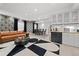 Spacious finished basement featuring a dining area, seating, bar, and modern décor at 2062 Hyacinth Rd, Highlands Ranch, CO 80129