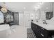 Bright bathroom showcasing black and gold fixtures, double vanity, and marble shower at 2062 Hyacinth Rd, Highlands Ranch, CO 80129