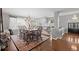 Formal dining room featuring a chandelier, hardwood floors, and a view of the foyer at 2062 Hyacinth Rd, Highlands Ranch, CO 80129