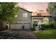 Charming two-story home with a two-car garage, beautiful landscaping, and a welcoming front porch at 2062 Hyacinth Rd, Highlands Ranch, CO 80129