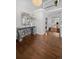 Elegant foyer with hardwood floors, high ceilings, decorative mirror and chandelier at 2062 Hyacinth Rd, Highlands Ranch, CO 80129