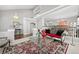 Open-concept living room with elegant decor and views of the dining room at 2062 Hyacinth Rd, Highlands Ranch, CO 80129