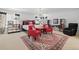 Stately main bedroom with chandelier, make up vanity, and red accents at 2062 Hyacinth Rd, Highlands Ranch, CO 80129