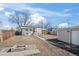 Backyard featuring a fire pit and garage, ready for outdoor enjoyment and storage at 4573 S Acoma St, Englewood, CO 80110