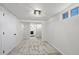 Finished basement with neutral carpet, access to the laundry room, and ample lighting, perfect for a rec room at 4573 S Acoma St, Englewood, CO 80110