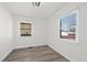 Bright bedroom with hardwood floors, two windows offering lots of natural light at 4573 S Acoma St, Englewood, CO 80110