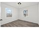 Bright bedroom with hardwood floors and modern windows offering great natural light at 4573 S Acoma St, Englewood, CO 80110